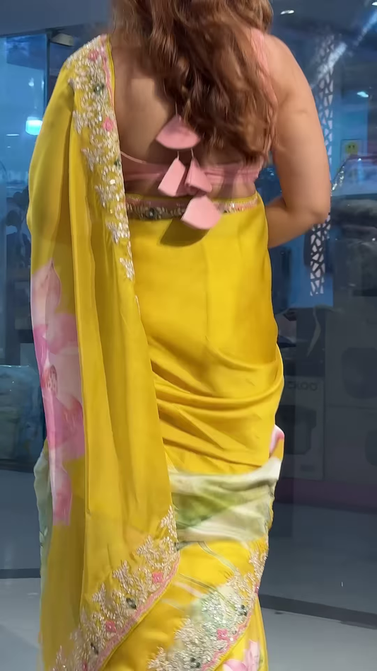 Sun-Kissed Yellow Floral Organza Saree with Intricate Zari Border