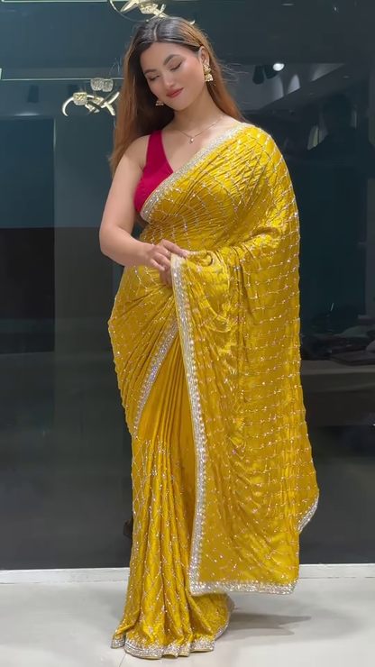 Radiant Yellow Georgette Saree with All-Over Sequin Lattice Pattern and Ornate Silver Zari Border